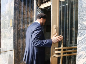 New York Knicks basketball player Derrick Rose arrives at U.S. District Court in downtown Los Angeles on Thursday, Oct. 6, 2016. (AP Photo/Damian Dovarganes)