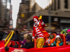 In this Thursday, Nov. 26, 2015, file photo, Ronald McDonald waves to the crowd during the Macy's Thanksgiving Day Parade, in New York. McDonald’s says Ronald McDonald is keeping a low profile with reports of creepy clown sightings on the rise. McDonald’s Corp. said Tuesday, Oct. 11, 2016, that it is being “thoughtful in respect to Ronald McDonald’s participation in community events” as a result of the “current climate around clown sightings in communities.” The company did not provide any other details about how often its red-haired mascot makes appearances, and how that will change. The move comes after a rash of hoaxes and pranks about scary clown sightings around the country, which have forced police to check for real threats. (AP Photo/Andres Kudacki, File)