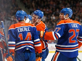 The Oilers celebrate a goal by Connor McDavid (97) during the Edmonton Oilers' NHL pre-season hockey game against the Vancouver Canucks at Rogers Place in Edmonton, Alta., on Saturday, Oct. 8, 2016.