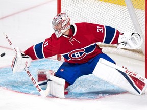 Montreal Canadiens goalie Carey Price deflects a shot as they face the Toronto Maple Leafs during first period of NHL pre-season hockey action on Oct. 6, 2016. (THE CANADIAN PRESS/Paul Chiasson)