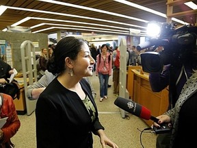 Reporters ask MP Maryam Monsef about her citizenship situation following a funding announcement at Trent University Wednesday, Oct. 12, 2016 in Peterborough, Ont. CLIFFORD SKARSTEDT/PETERBOROUGH EXAMINER/POSTMEDIA NETWORK