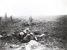 Canadian machine gunners dig themselves in shell holes at Vimy Ridge in April 1917. (Department Of National Defence/National Archives of Canada)