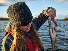 Fish sure put the feed on during the fall months, says columnist Ashley Rae, holding a chunky smallmouth bass. (Supplied photo)