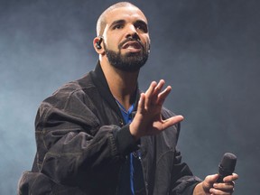 FILE - In this Oct. 8, 2016 file photo, Drake performs on stage in Toronto, Canada. Drake is the leading nominee with 12 nominations at the Soul Train Awards. The show will air on BET and Centric on Nov. 27.(Photo by Arthur Mola/Invision/AP, File)