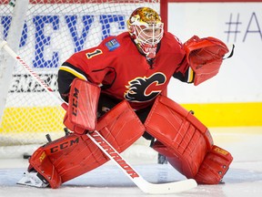 Flames goalie Brian Elliott warms up before a game against the Oilers in Calgary on Sept. 26, 2016. (Lyle Aspinall/Postmedia Network)
