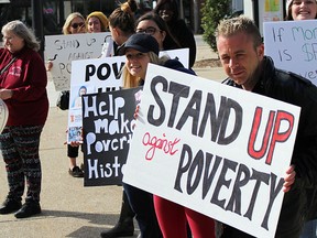 Rally-goers are show in this file photo gathering at the steps of city hall in Sarnia for the community's annual Stand up Against Poverty rally. This year's rally is set for Friday, noon to 1 p.m., at city hall. (File photo)