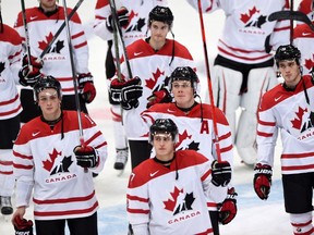 Members of team Canada wave to the crowd after being defeated by Finland in quarterfinal hockey action at the IIHF World Junior Championship, in Helsinki, Finland, on Saturday, Jan. 2, 2016. (THE CANADIAN PRESS/Sean Kilpatrick)