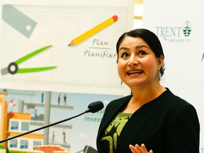 Peterborough-Kawartha MP and Democratic Institutions Minister Maryam Monsef talks to Trent University officials at the Bata Library Wednesday, October 12, 2016 in Peterborough. (Clifford Skarstedt/Postmedia Network)