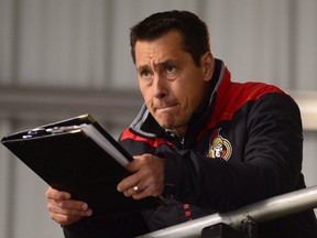 Ottawa Senators head coach Guy Boucher watches his team during day two of training camp in Ottawa on Friday, Sept. 23, 2016. (THE CANADIAN PRESS/Sean Kilpatrick)