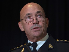 RCMP commissioner Bob Paulson speaks during an update on RCMP harassment related litigation in Ottawa, Thursday October 6, 2016. Paulson has apologized to hundreds of current and former female officers and employees for alleged incidents of bullying, discrimination and harassment. THE CANADIAN PRESS/Adrian Wyld