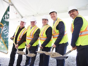 Dignitaries take part in the sod turning for the Maley Drive extension on Wednesday, Oct. 12. From left are; Tony Cecutti, the city's general manager of infrastructure services, Mayor Brian Bigger, MPs Marc Serre and Paul Lefebvre, and MPP Glenn Thibeault. Gino Donato/Sudbury Star