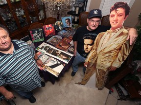 Alex Reid (left) and Richard Sturtz pose with a few of the goodies available for sale at Rockin' Richard's Record and CD sale at the Victoria Inn in Winnipeg on Sunday. (Kevin King/Winnipeg Sun)