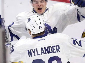 Maple Leafs’ top pick Auston Matthews celebrates his second of four goals with William Nylander in his opening-night debut against the Senators at the Canadian Tire Centre. (Wayne Cuddington/Postmedia Network)