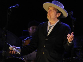 This file photo taken on July 22, 2012, shows U.S. poet and folk singer Bob Dylan performing during the 21st edition of the Vieilles Charrues music festival in Carhaix-Plouguer, western France. Dylan won the Nobel Literature Prize on Oct. 13, 2016, the first songwriter to win the prestigious award and an announcement that surprised prize watchers. (FRED TANNEAU/AFP/Getty Images)
