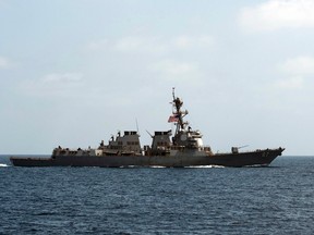 In this image released by the U.S. Navy, the USS Mason (DDG 87), conducts maneuvers as part of a exercise in the Gulf of Oman on Sept. 10, 2016. For the second time this week two missiles were fired at the USS Mason in the Red Sea, and officials believe they were launched by the same Yemen-based Houthi rebels involved in the earlier attack, a U.S. military official said Wednesday.  (Mass Communication Specialist 1st Class Blake Midnight/U.S. Navy via AP)