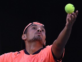 Nick Kyrgios serves against Mischa Zverev during their men's singles match at the Shanghai Masters tennis tournament in Shanghai on Oct. 12, 2016. (AFP PHOTO/JOHANNES EISELEJOHANNES)