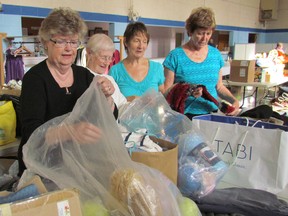 Sorting through donations of clothing for the Fall Rummage Sale at Central United Church on Thursday October 13, 2016 in Sarnia, Ont., are, from left, Jean Gordon, Eileen MacDiarmid, Kathy Hay and Pam Jakobs. The sale at the church on George Street runs Friday, noon to 2 p.m., and Saturday, 9 a.m. to 11 a.m. (Paul Morden/Sarnia Observer)