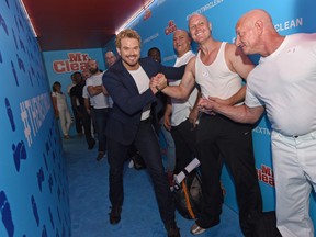 Twilight hunk Kellan Lutz cheering on his competition for the Next Mr. Clean search.