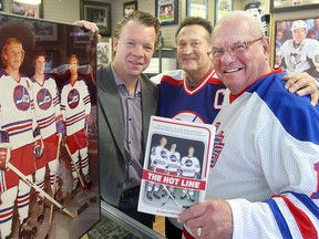 Author Geoff Kirbyson (left) stands with former WHA Jets players Bill Lesuk (centre) and Joe Daley earlier this week. Kirbyson has written a book on the famed Hot Line. (Brian Donogh/Winnipeg Sun)