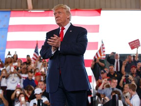 Republican presidential candidate Donald Trump arrives to speak at a campaign rally, Wednesday, Oct. 12, 2016, in Ocala, Fla. (AP Photo/ Evan Vucci)