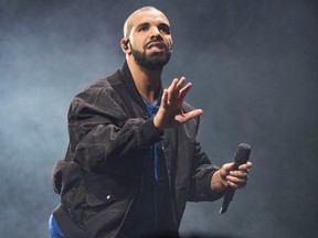 In this Oct. 8, 2016 file photo, Drake performs on stage in Toronto, Canada. Drake`s Virginia Black Decadent American Whiskey is flying off the shelves at the LCBO. (Photo by Arthur Mola/Invision/AP, File)