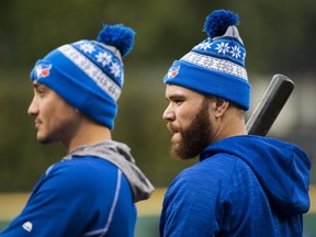 Toronto Blue Jays catcher Russell Martin, right, and teammate Darwin Barney take part in batting practice in preparation of game one of the American League Championship Series in Cleveland on Thursday, October 13, 2016. (THE CANADIAN PRESS/Nathan Denette)