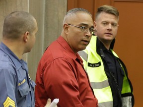 Linden Police officer Angel Padilla, who was involved in the apprehension of Ahmad Khan Rahimi arrives for a hearing for Rahimi at the Union County Courthouse, Thursday, Oct. 13, 2016, in Elizabeth, N.J. Rahimi is accused of setting off bombs in New Jersey and New York in September. (AP Photo/Julio Cortez)