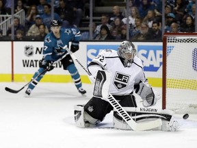 Kings goalie Jonathan Quick deflects a shot on goal against the Sharks during first period NHL action in San Jose, Calif., on Wednesday, Oct. 12, 2016. (Marcio Jose Sanchez/AP Photo)