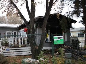 Fire ripped through a southeast Edmonton mobile home at 194 Lee Ridge Road on Thursday, Oct. 13, 2016. Homeowners Sherry Robinson and Lawrence Renz said while firefighters rescued one of their dogs, their pet miniature pincher and six cats died in the blaze. CLAIRE THEOBALD Postmedia
