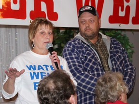 North Kent Coun. Leon LeClair, right, took the brunt of scorn many people, including Yvonne Profota, who attended a public information meeting north of Chatham, Ont. on Thursday October 13, 2016, regarding what they feel is a lack of action or concern by the Municipality of Chatham-Kent regarding turbidity problems with water wells believed to be caused by vibrations from industrial wind turbines. The meeting was organized by the citizen group Water Wells First, which is planning action to protect other water wells from planned wind farms that are slated to be built in the north Chatham-Kent area. (Ellwood Shreve/Chatham Daily News)