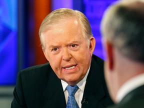 In this Nov. 16, 2009 file photo, Lou Dobbs, left, speaks with Bill O'Reilly during a segment for Fox News channel's "The O'Reilly Factor," in New York. Dobbs apologized Thursday, Oct. 13, 2016, for  tweeting the address and phone number of a woman who alleged Donald Trump had groped her without her consent. (AP Photo/Kathy Willens, File)
