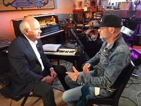 Tragically Hip frontman Gord Downie news anchor Peter Mansbridge speaks with in Toronto on Tuesday Oct. 11, 2016. Downie says his memory is fading as he battles terminal brain cancer. (THE CANADIAN PRESS/HO-CBC)