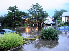 Carmen and Garry Zawierucha's home in the Millbournes area after a storm in 2012. Photo by Bruce Edwards
