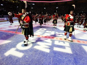 File photo - The 48th Highlanders Pipes and Drums band play before the start of the NHL season for the Toronto Maple Leafs and the Montreal Canadiens in Toronto on Wednesday, October 8, 2014. THE CANADIAN PRESS/Frank Gunn