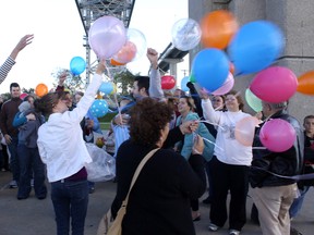 This file photo shows those who gathered at the Blue Water Bridge in 2010 for a Pregnancy and Infant Loss balloon release. A candlelight memorial is being held Saturday, 7 p.m., at Sarnia City Hall to mark Pregnancy and Infant Loss Awareness Day. (File photo/The Observer)