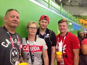 Blair Nesbitt, 24, stands with his family during the Paralympics in Brazil. - Photo submitted