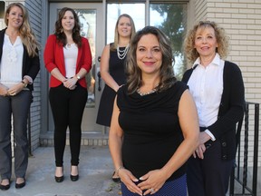 Emily Mountney-Lessard/The Intelligencer
Victim Services of Hastings, Prince Edward, Lennox and Addington executive director Lisa Warriner is shown here with Victim Services staff Patty Whelan (right) and Johanna Webb, Elizabeth Moss and Hana Enright (back) on Friday in Belleville.