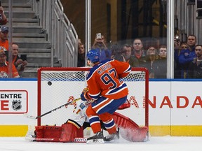 Edmonton's Connor McDavid scores on a penalty shot during the second period of a NHL game between the Edmonton Oilers and the Calgary Flames at Rogers Place in Edmonton on Oct. 12, 2016. (Ian Kucerak/Postmedia)