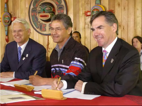 In July 2006, Jim Prentice, former federal Minister of Indian Affairs and Northern Development (right), signed an agreement with then B.C. Premier Gordon Campbell (left) and Chief Negotiator for First Nations Nathan Matthew (centre) related to First Nations education in British Columbia. (Glenn Baglo/Postmedia)