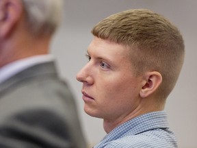 Sean Phillips listens as his former girlfriend Ariel Courtland testifies during his trial at the Mason County Courthouse on Thursday, Sept. 29, 2016, in Ludington, Mich. Phillips was found guilty of second degree murder in the disappearance of his 4-month-old daughter. Katherine Phillips, known as "Baby Kate," disappeared in 2011 in the Ludington area, about 80 miles northwest of Grand Rapids. (Joel Bissell/Muskegon Chronicle-MLive.com via AP)