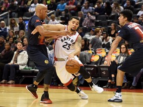 Toronto Raptors' Fred VanVleet works around San Lorenzo de Almagro's Guillermo Diaz during NBA pre-season action on Oct. 14, 2016 in Toronto. (THE CANADIAN PRESS/Jon Blacker)