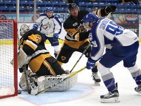 Sudbury Wolves Dmitry Sokolov pokes the puck past Hamilton Bulldogs goalie Cole Ceci during OHL action from the Sudbury Community Arena in Sudbury, Ont. on Friday October 14, 2016. Gino Donato/Sudbury Star/Postmedia Network