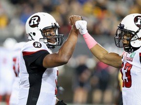 Ottawa Redblacks quarterback Henry Burris celebrates with Ottawa Redblacks wide receiver Khalil Paden during CFL action against the Hamilton Tiger-Cats in Hamilton on Oct. 14, 2016. (THE CANADIAN PRESS/Peter Power)