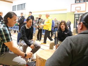 Members of the Black Bull Moose Singers drum and sing as elder Vince Pawis presides over a smudging ceremony at the grand opening of St. David Catholic Elementary School on Friday. Gino Donato/Sudbury Star