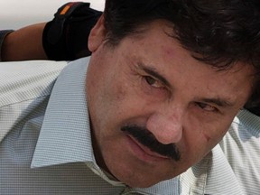 In this Feb. 22, 2014 file photo, Joaquin "El Chapo" Guzman is escorted to a helicopter in handcuffs by Mexican navy marines at a navy hanger in Mexico City. Mexico’s national security commissioner says the jailed drug lord could be extradited to the United States by early next year. Renato Sales tells Televisa it could happen “in January or February.” A lawyer for Guzman said recently that there there could be a court decision on extradition around the end of the year, but either side would then be able to appeal. (AP Photo/Eduardo Verdugo, File)