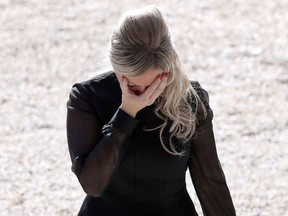 Cindy Pellegrini, who lost six members of her family, reacts after her speech during a national tribute on October 15, 2016 in Nice, France. (Getty Images)