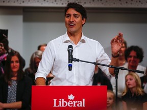 Prime Minister Justin Trudeau, centre, gestures as he attends a campaign event for Liberal party byelection candidate Stan Sakamoto in Medicine Hat, Alta., Thursday, Oct. 13, 2016.(THE CANADIAN PRESS/Jeff McIntosh)