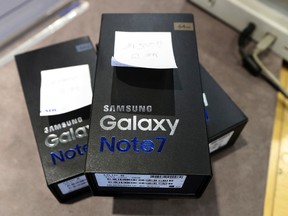 Returned boxes of Samsung E Galaxy Note 7 smartphones are placed at a shop of South Korean mobile carrier in Seoul, South Korea, Thursday, Oct. 13, 2016. (AP Photo/Lee Jin-man)