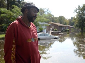 William Murrell stands at the edge of his property, which is partially underwater, in Kinston, N.C. , Friday, Oct. 14, 2016. (Zach Frailey/Daily Free Press via AP)