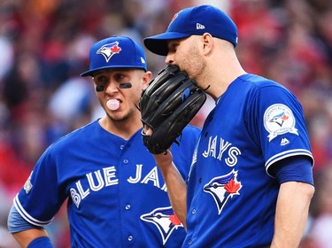 Toronto Blue Jays starting pitcher J.A. Happ stands on the mound as teammate Troy Tulowitzki looks on against the Cleveland Indians during fifth inning of Game 2 in the American League Championship Series in Cleveland on Oct. 15, 2016. (THE CANADIAN PRESS/Nathan Denette)